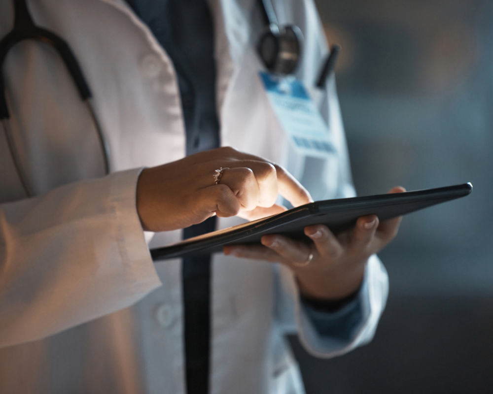 medical professional on tablet